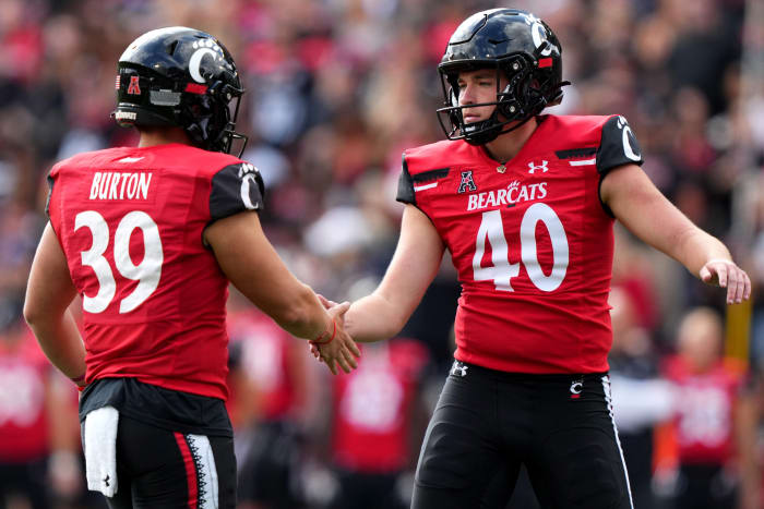 Sep 24, 2022; Cincinnati, Ohio, USA; Cincinnati Bearcats place kicker Ryan Coe (40) is congratulated by place kicker Bryce Burton (39)) after a successful field goal against the Indiana Hoosiers in the first quarter at Nippert Stadium. Mandatory Credit: Kareem Elgazzar/Cincinnati Enquirer via USA TODAY NETWORK